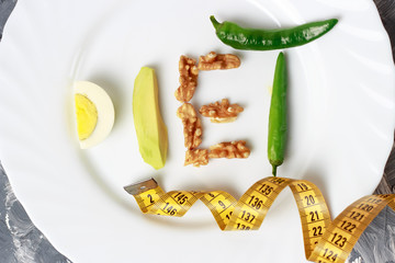 Inscription Diet made of nuts, eggs and avocado. weight loss concept