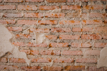 Old brick wall texture background,Painted Distressed Wall Surface. Shabby Building Facade With Damaged 