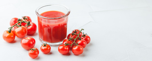 Glass of fresh organic tomato juice