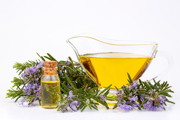 Rosemary essential oil in a small bottle. Natural aroma cosmetic oil