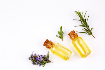 Rosemary essential oil in a small bottle. Natural aroma cosmetic oil