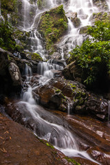 Beautiful waterfalls and fine mist in the forest in Thailand