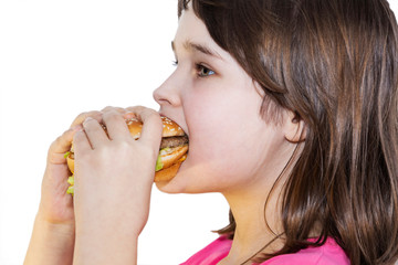 portrait of a beautiful girl, teenager and schoolgirl, holding a hamburger on a white background