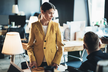 Woman manager talking to the chief in company office