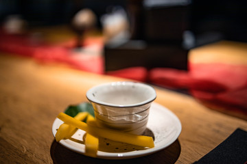 cup of tea with teapot and cup on wooden table