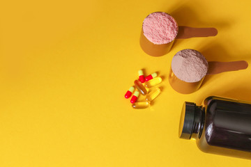 Sports medical vitamins and drugs. Two measuring spoons of whey protein 