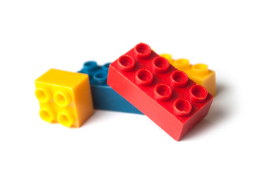 closeup of plastic bricks construction on white background