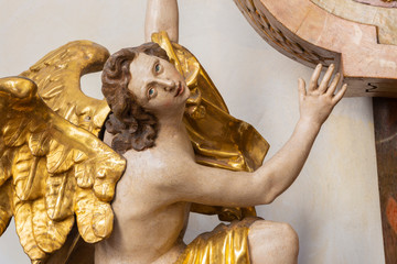 PRAGUE, CZECH REPUBLIC - OCTOBER 12, 2018: The carved polychrome baroque statue of angel from the...