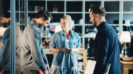 Meeting of three employees in the office. Daily business situation