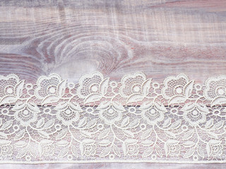 White lace on wooden background