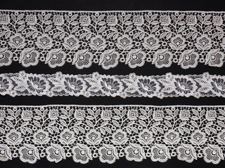 White lace on black background