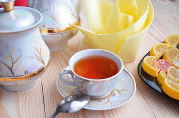 Marmalade and tea on white table background
