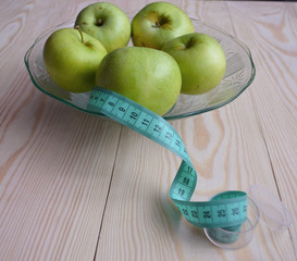 Ripe red apples on wooden background