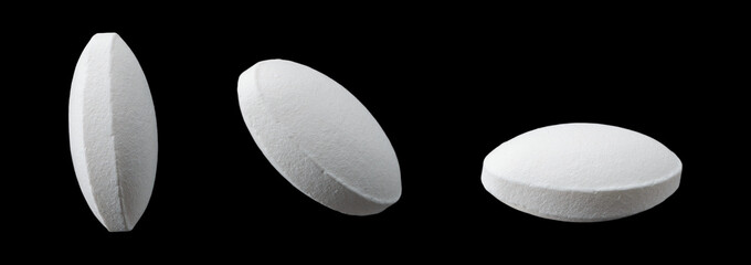 Row of white tablet pills