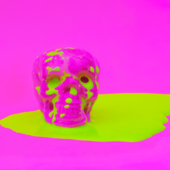  Skull in acid paint. Minimal design fashion art