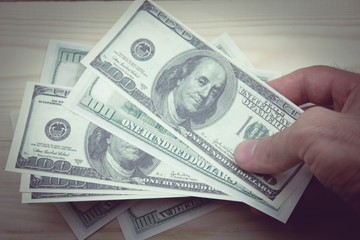  man displaying a spread of cash