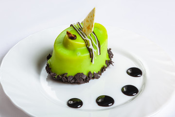Green cupcake on a white plate