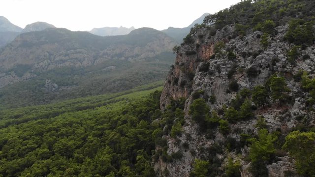 Aerial view of Mountains and Coast National Park in Turkey, Beldibi village. Beautiful mountain landscape with pines and mountains