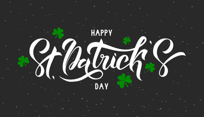 Naklejka na ściany i meble Happy St. Patrick Day lettering on grey background with green trefoils. Beautiful Vector illustration for greeting card/poster/banner template.