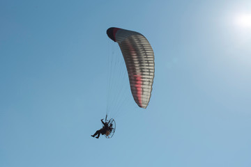 A paraglider in the sky