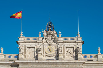 view of the clock of the facade of the royal palace in Madrid. Spain
