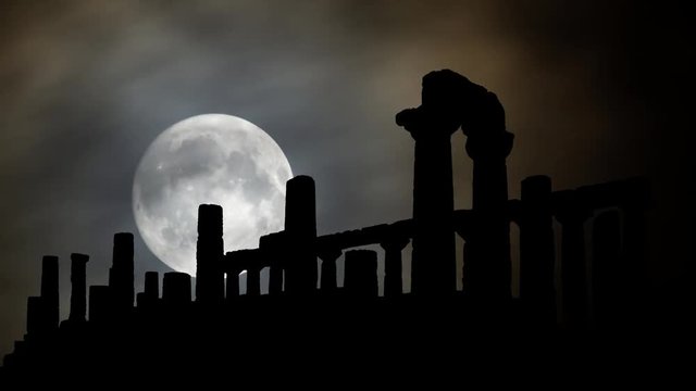 The Valley of the Temples or Valle dei Templi by Night with Full Moon, archaeological site in Agrigento, one of the most outstanding examples of Greater Greece art and architecture, Sicily, Italy