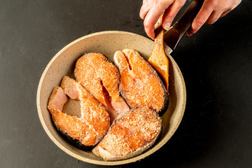 fried fish on a pan at the kitchen
