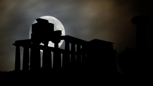 The Valley of the Temples or Valle dei Templi by Night with Full Moon, archaeological site in Agrigento, one of the most outstanding examples of Greater Greece art and architecture, Sicily, Italy