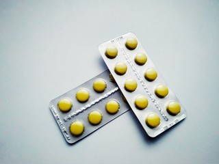 Few medicine pills pack on white background