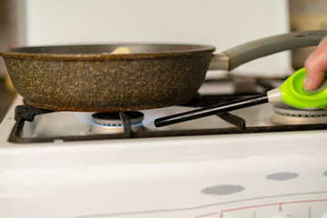 persons hand burning gas stove