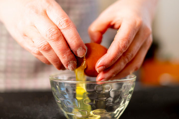 woman beating egg at the kitchen