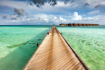 Fototapeta premium Wooden jetty on the ocean on Maldives Islands.