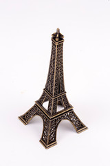 Fototapeta na wymiar Miniatur Eiffel Tower Paris isolated. Travel concept photo.