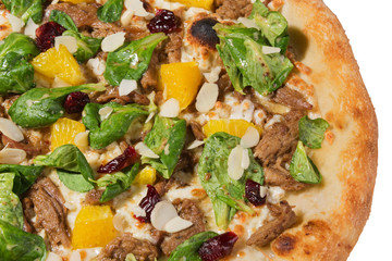 Italian pizza with duck meat and oranges, close-up shot, on a white background