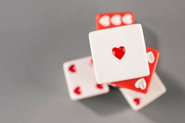 Love dices playing for endearment. One heart in focus is more than enough to smile