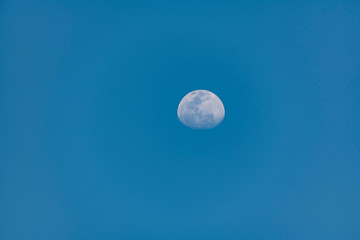the moon in blue sky