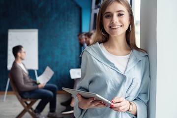 Portrait of smiling woman with tablet pc.