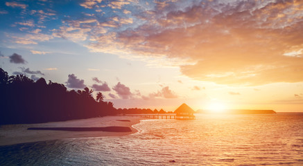 Sun setting on a tropical island.