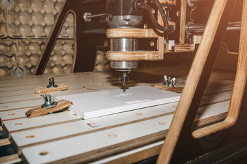 Computer numerical control machine for wooden tools. CNC equipment for maintenance control and details.