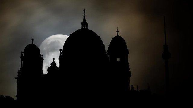 Berlin Cathedral (Berliner Dom) and TV Tower "Alex" in Background by Night with Full Moon, two of  Berlin's most famous landsmarks in the City, Germany