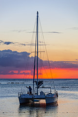 Sea voyage on a sail catamaran at sunset, Mauritius island