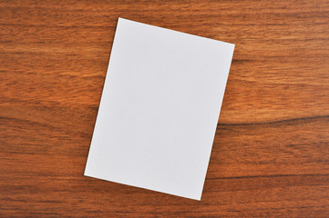 White paper on wooden table