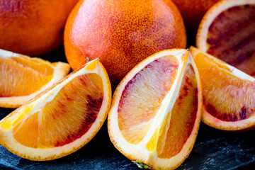 Fresh Juicy Blood Oranges Whole and Sliced Close Up (macro) shallow depth of field