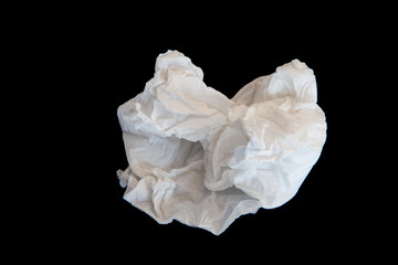 Used screwed paper tissue on dark background. Valueless.
