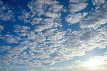 Beautiful celestial landscape. Clouds and sun at sunset. Clouds and sun at dawn. The radiance of the sunlight.