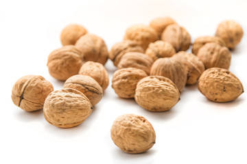 Whole walnuts in white background. Bunch of walnuts isolated.