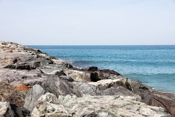 Fototapeta na wymiar Picturesque view of beautiful rocky beach on sunny day