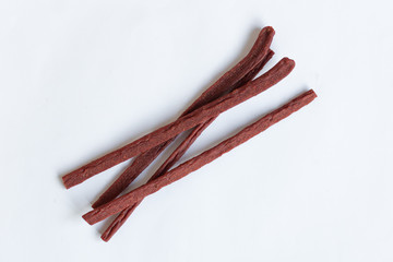 Bone for dog's eatting isolated on white background. Petfood top view. 