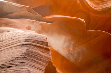 Sun Beams passing through Antelope Slot Canyon in Paige Arizona, with dust particles 