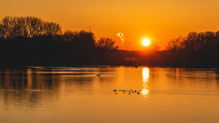 Fototapeta premium Beautiful winter sunset with reflections at Plattling-Isar-Bavaria-Germany